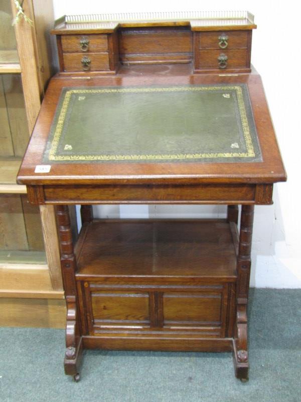 OAK DAVENPORT with brass gallery rail to top, 4 trinket drawers, fitted lower shelf with 2 drawers