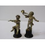 PAIR OF SILVER GILT PUTTI MUSICIANS on circular ebonised wood bases, 9cm height, bases a/f