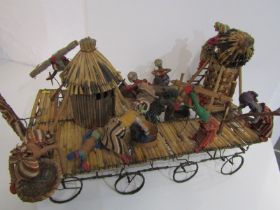 NOVELTY AFRICAN PULL ALONG TOY, wheeled trolley with moving figures and tribal hut, etc, 60cm length