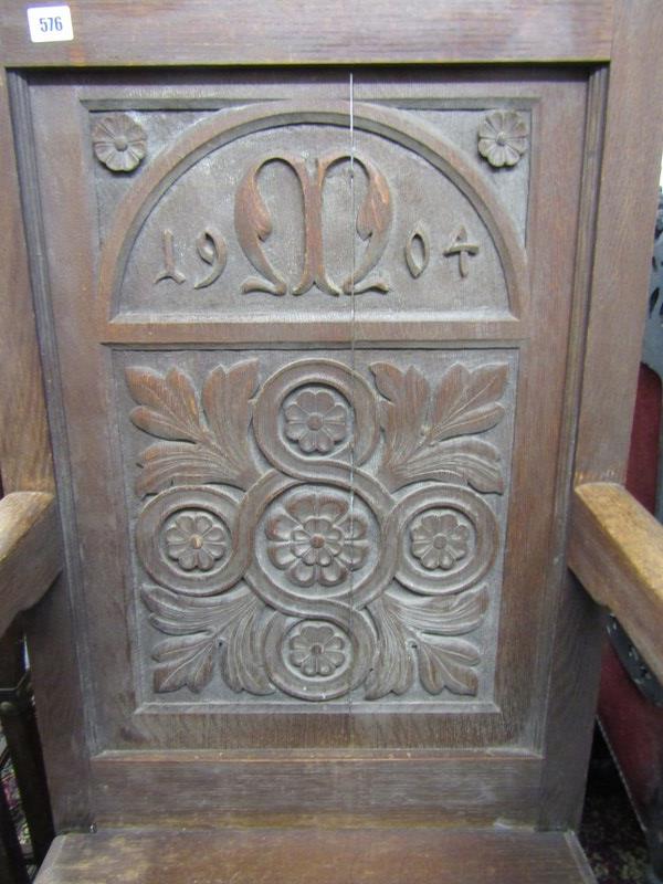 HEAVY CARVED ARMCHAIR, with carved panel back dated 1904 and rising seat - Image 2 of 3