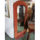 BEVEL EDGED WALL MIRROR, shaped mirror in an upholstered frame with lower shaped shelf, 138cm height