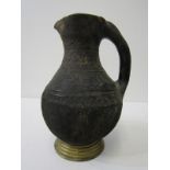 ANTIQUE POTTERY JUG, possibly North African with incised decoration, 20cm height