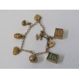 GOLD CHARM BRACELET, 9ct yellow gold charm bracelet with padlock clasp, set 8 charms including money