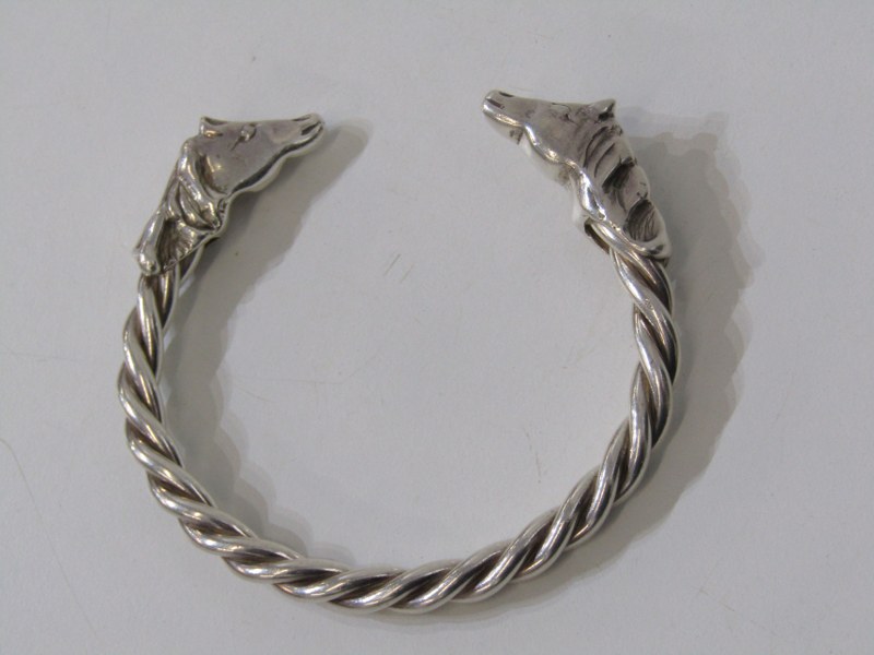 WHITE METAL, TESTS AS SILVER, double horse head torque bangle, approx. 68.5 grams