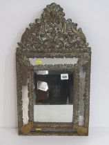 ANTIQUE BRASS MIRROR, bevel edged mirror in a foliate decorated frame in relief, 60cm height
