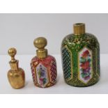 BOHEMIAN GLASS SCENT BOTTLES, red glass gilt decorated scent bottle with floral panels 6cms high,