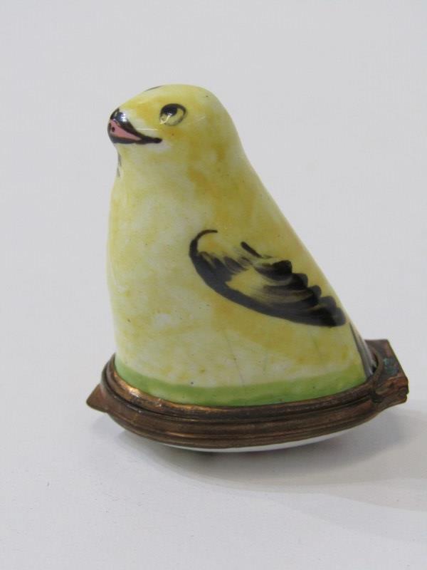 PORCELAIN THIMBLE HOLDER, in the form of a bird with gilt mounts and a plated thimble