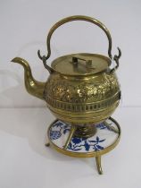 SOUTER BRASS KETTLE, with foliate decoration on a brass and ceramic stand with burner inset, 31cm