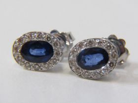 SAPPHIRE & DIAMOND CLUSTER EARRINGS, pair of 18ct white gold earrings, set oval sapphires surrounded