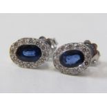 SAPPHIRE & DIAMOND CLUSTER EARRINGS, pair of 18ct white gold earrings, set oval sapphires surrounded