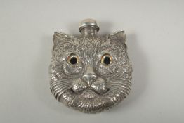 A heavy silver plated double sided cats head perfume bottle, 5cm diameter 63 grams.