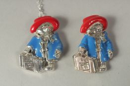 A silver and enamel Paddington Bear pendant chain and brooch in a box.