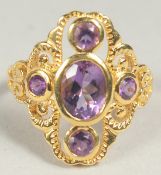 A silver gold plated amethyst ring size M in a box.