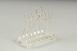 A SILVER PLATED GOLF TOAST RACK.