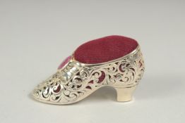 A silver ruby set shoe pin cushion, 5cm.