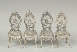 A set of four novelty silver salon chairs.