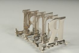 A SILVER PLATED LETTER TOAST RACK.