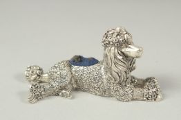A silver plated poodle pin cushion, 8cm long.