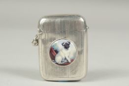 An engine tuned silver vesta case, Birmingham 1914, with a circular enamel of a pug dog.