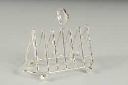 A SILVER PLATED FOX HUNTING TOAST RACK.