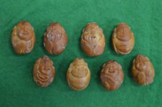 A group of Chinese carved wood miniature okimono's.