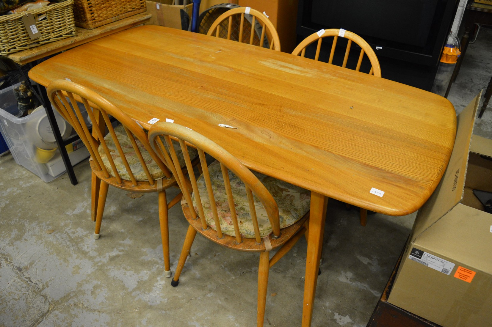 An Ercol table and four chairs.