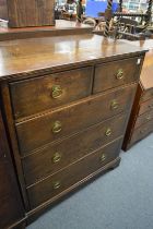 An oak straight front chest of drawers.