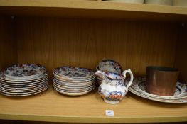 A quantity of ironstone china and a copper pot.
