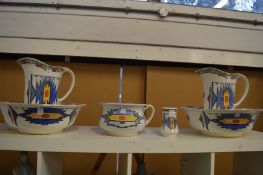 A Burleigh Ware wash set comprising: pair of jugs with bowls, a chamber pot and toothbrush mug,