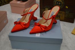 A pair of ladies Prada red silk shoes, size 36.5, boxed.