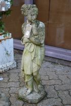 A reconstituted stone garden ornament modelled as a classical young lady.