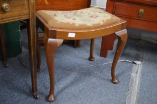 An Edwardian inlaid mahogany music seat and a dressing table stool.
