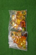 A collection of small bags containing colourful stones.