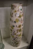 A large floral decorated pottery vase.