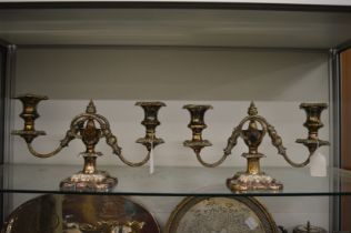 A pair of plated twin branch candelabra.