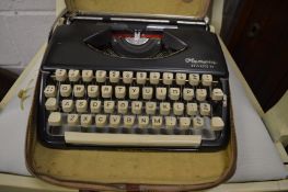 An Olympia Splendid 99 portable typewriter.