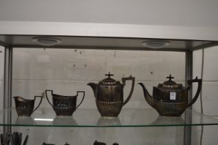 A plated four piece tea service.