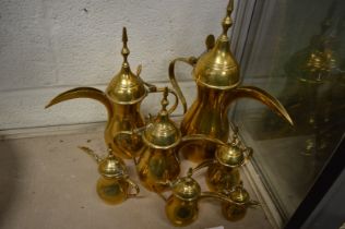 A collection of Eastern brass ewers.