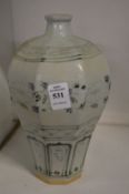A Chinese blue and white baluster shaped vase.