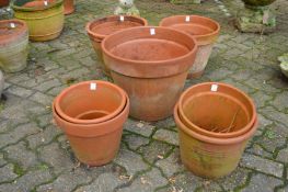 A collection of large terracotta plant pots.