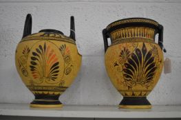 Two Egyptian style amphora vases.