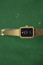 A ladies wrist watch.