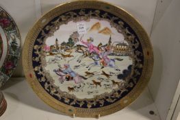 A decorative dish depicting a hunting scene.