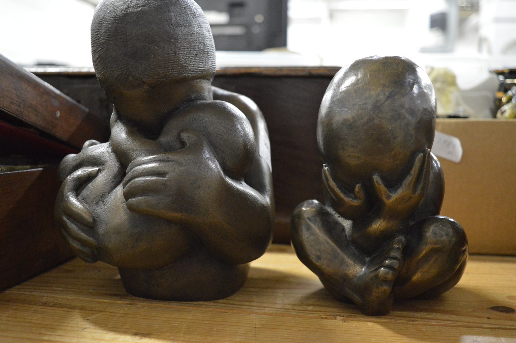 Theresa Gilder, a cast bronzed composite group of a mother and child together with a similar