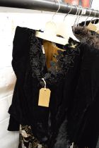 A ladies embroidered black velvet dress with similar bodice.