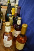 Four half bottles of Sauternes and various other wines and Champagnes.