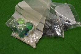 A collection of small bags containing colourful stones.