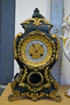 A decorative mantle clock.