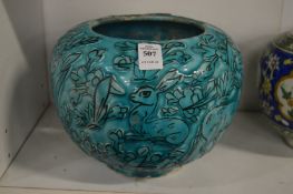 Continental turquoise glazed pottery bowl with incised decoration depicting animals in a woodland