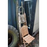 Folding chair and two folding step ladders.